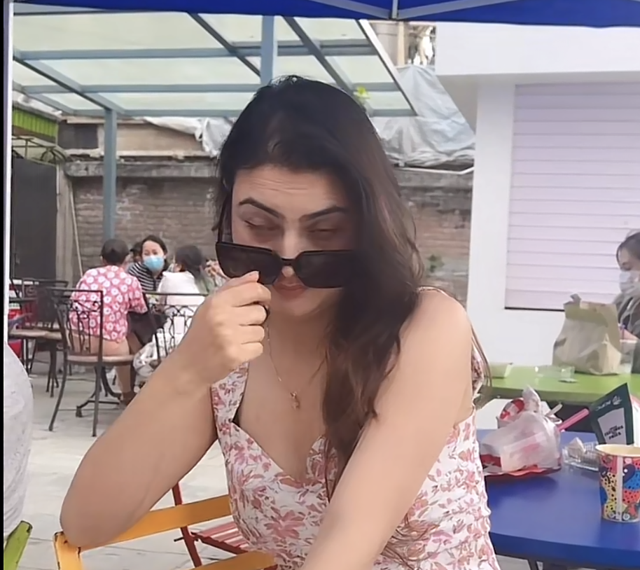 Ranjana peeking over her sunglasses